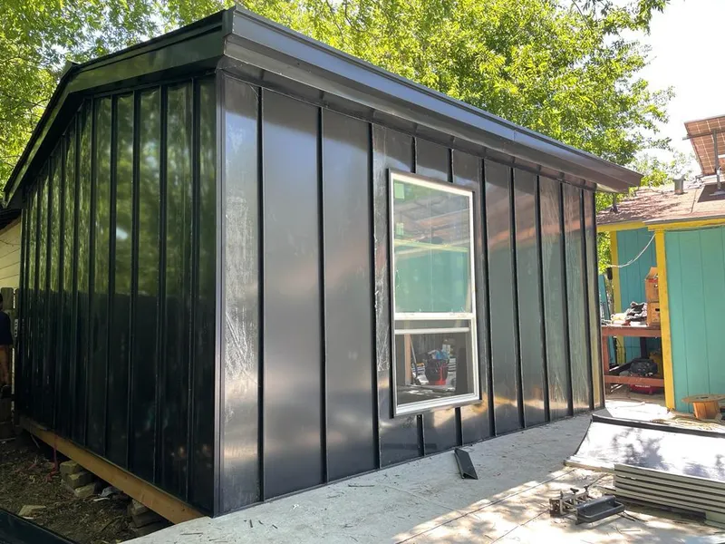 Black standing seam metal wall panels for Roof Inspection in Morton